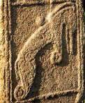 Dolphin carved in relief on Maiden stone